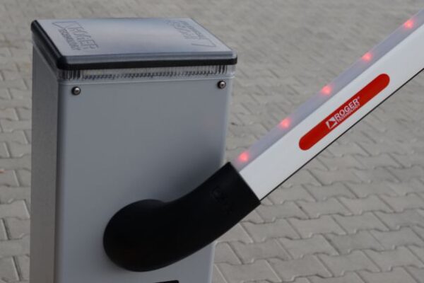 Roger Technology barrier cabinet and arm on a paved entrance