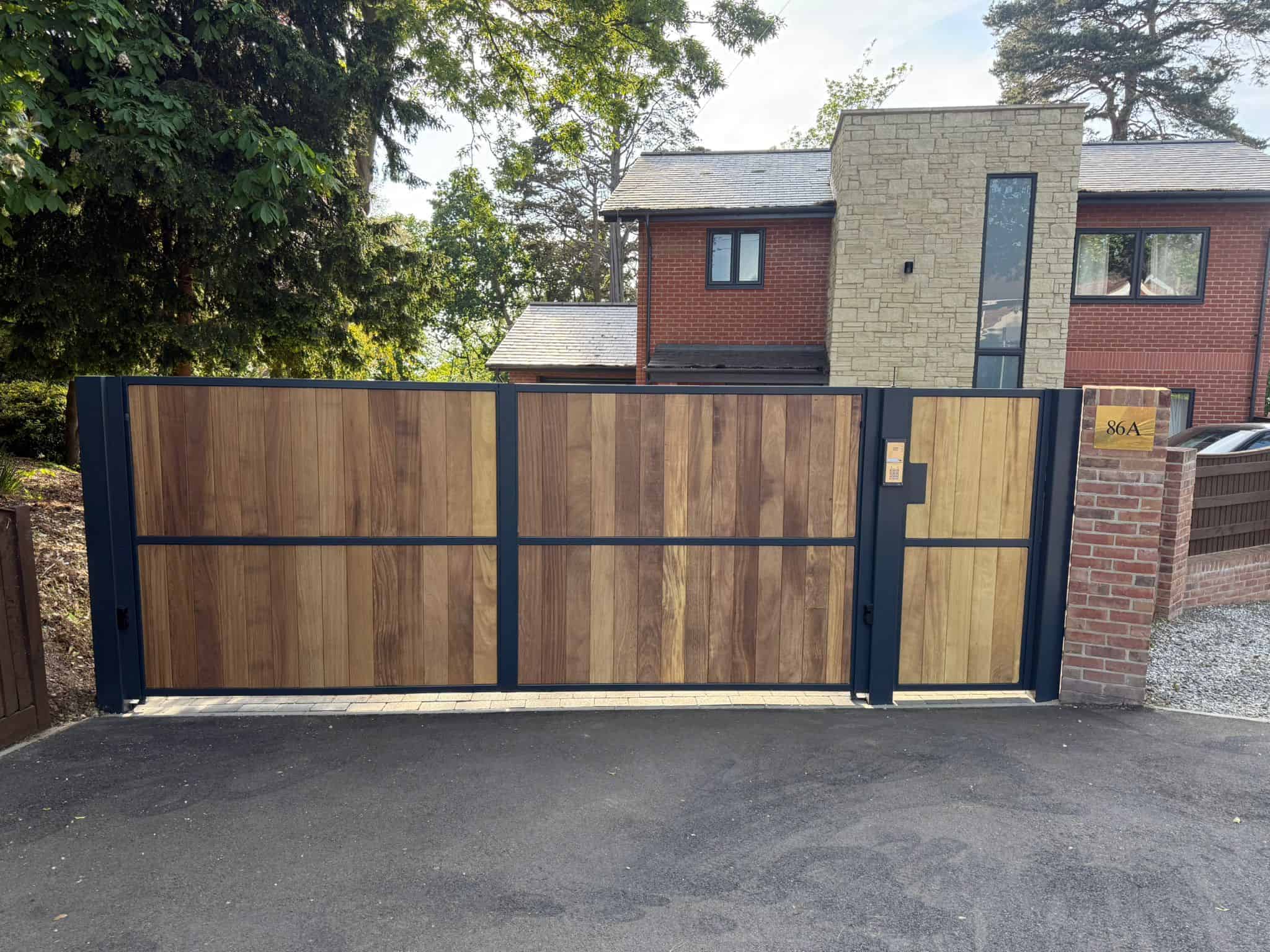 Steel framed Iroko bespoke gates Southampton premium driveway entrance